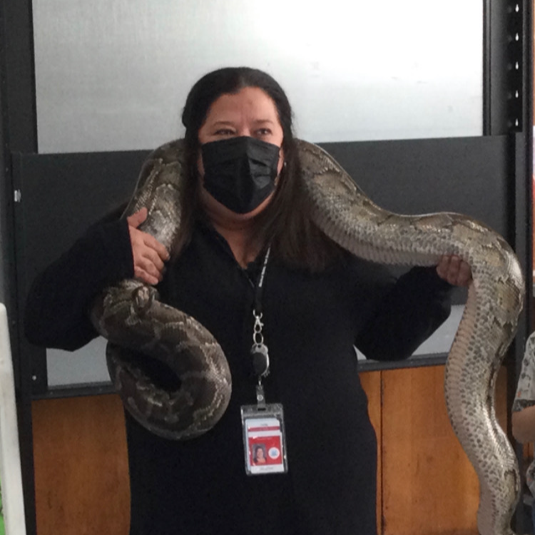 Principal Laurie holding a snake.