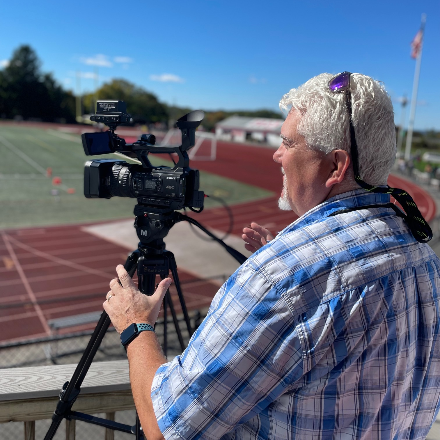 Steven Costa works with students in producing sport videos for WPHS Live.