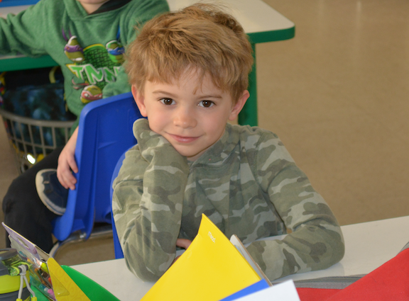 Student at desk in classroom.