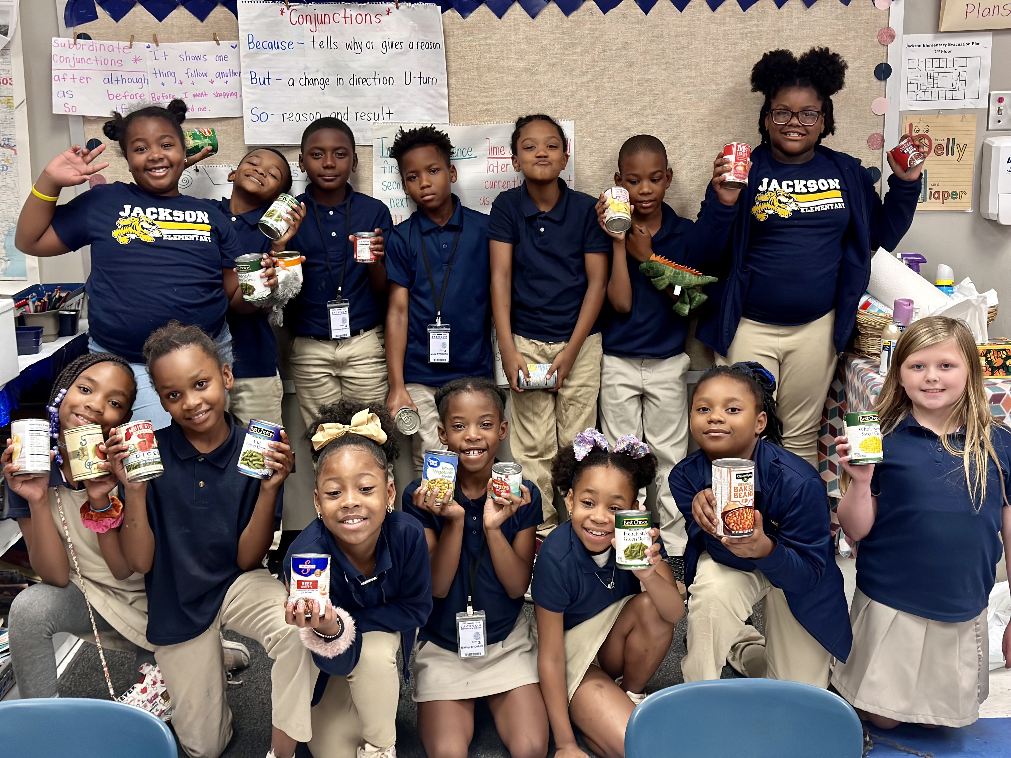 A group of students with canned food.