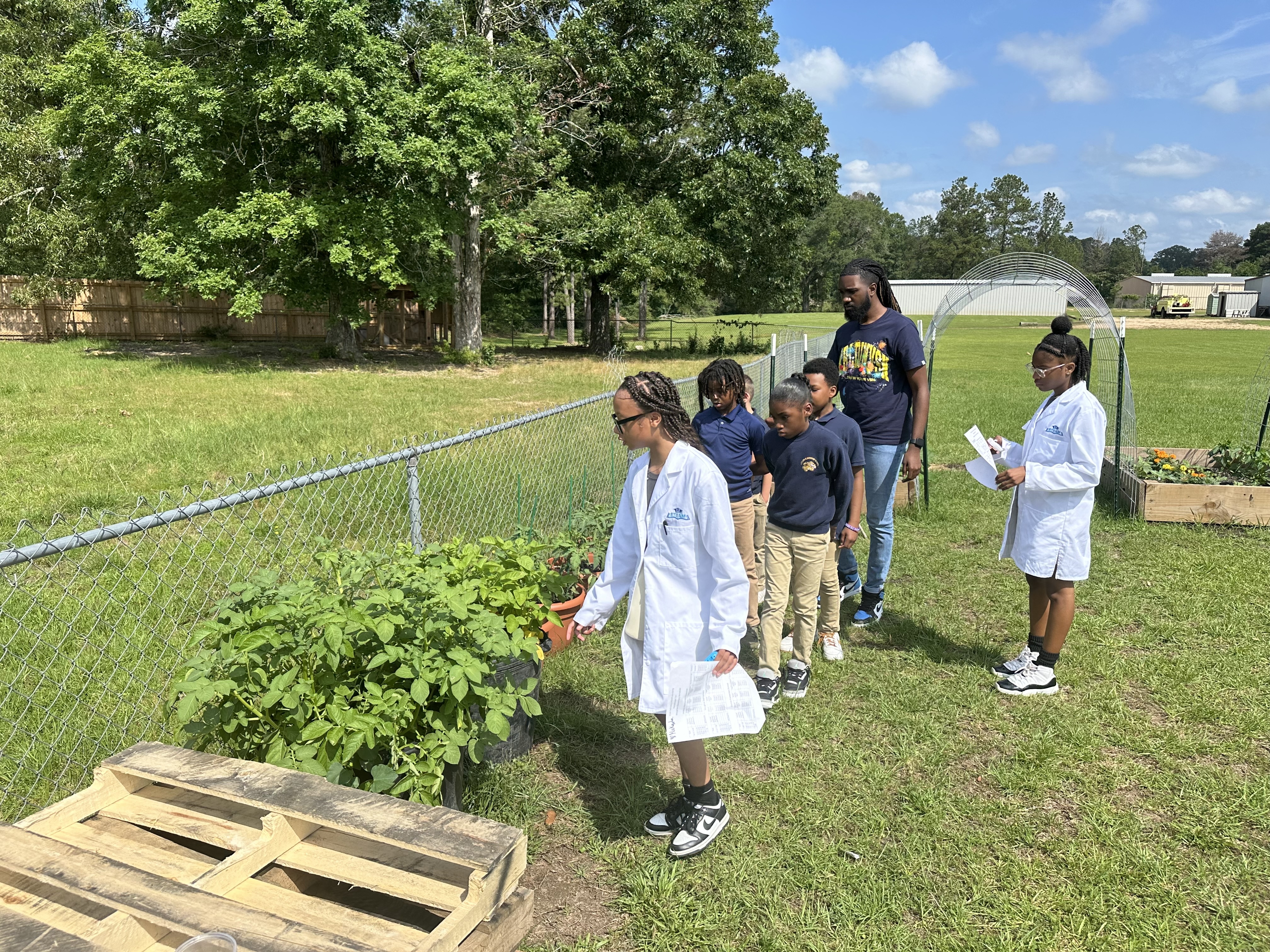 Students showcasing gardens.