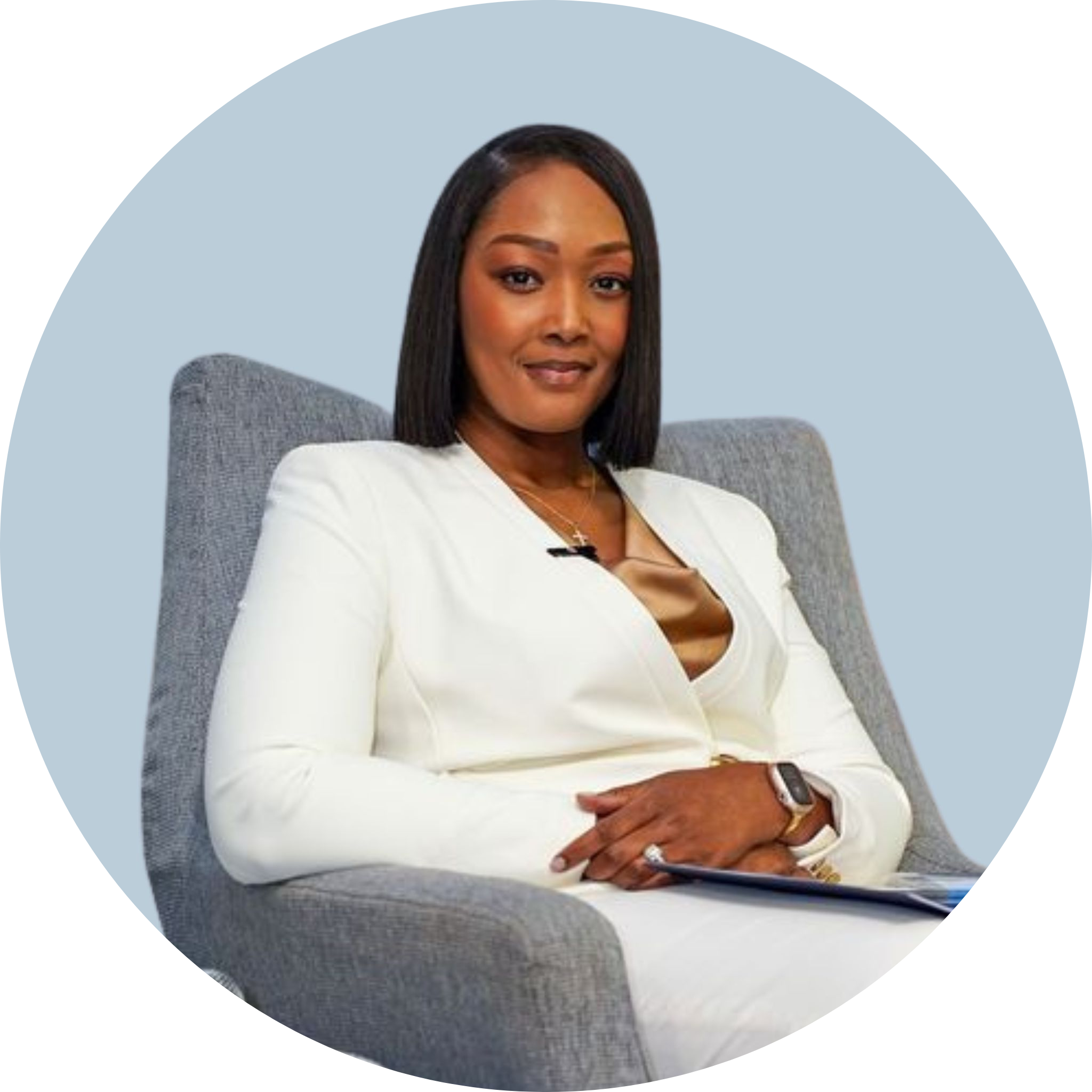 A smiling woman in a white suit