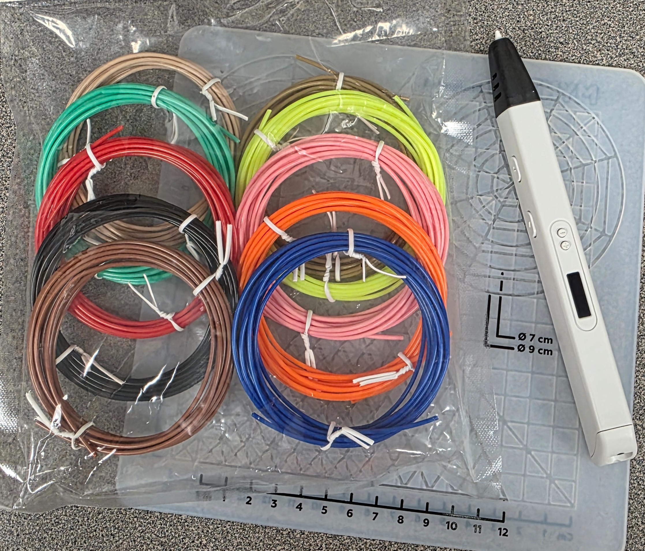 3D pen with package of multi-colored filament and drawing mat