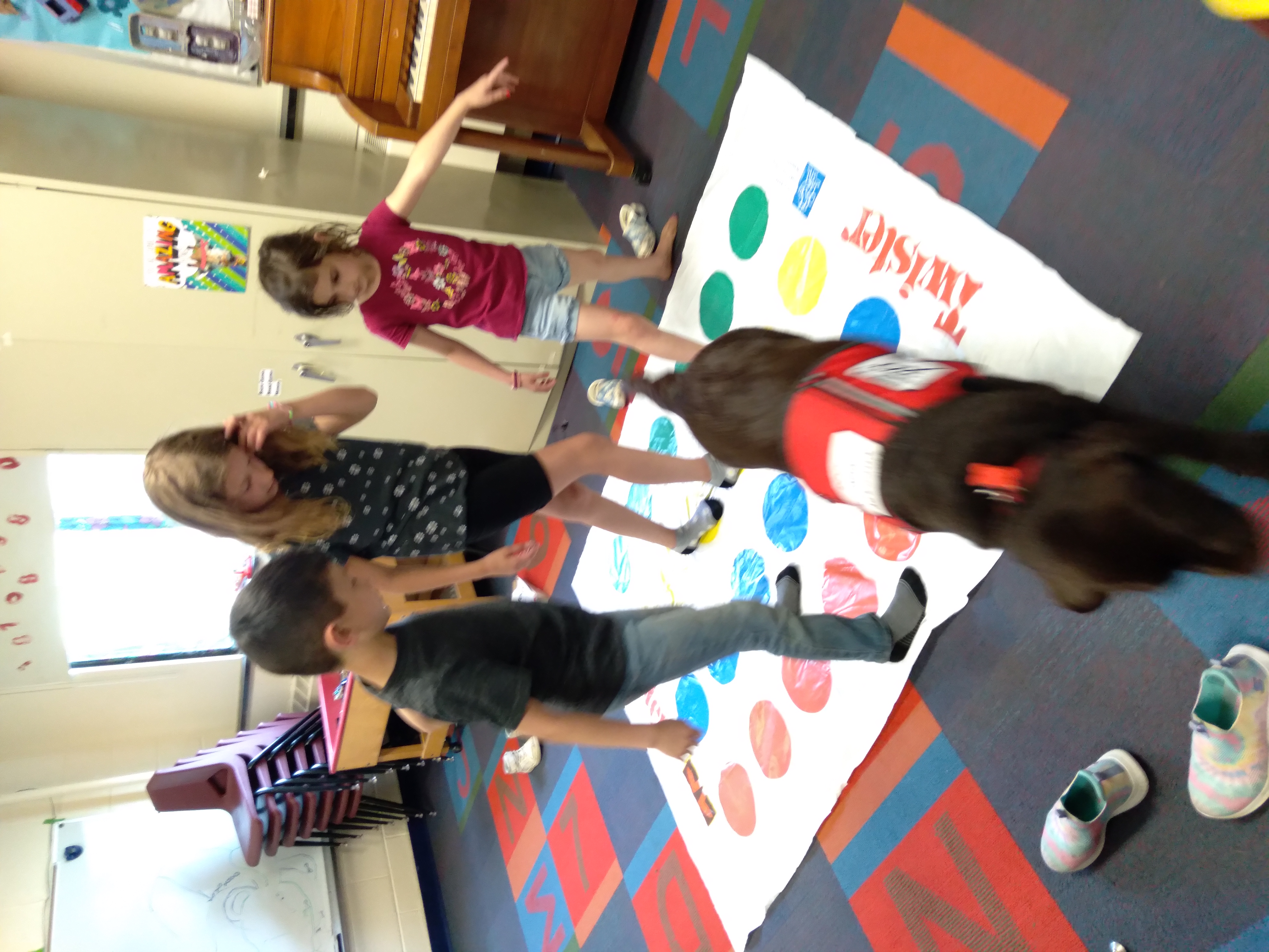 school age -students playing twister-