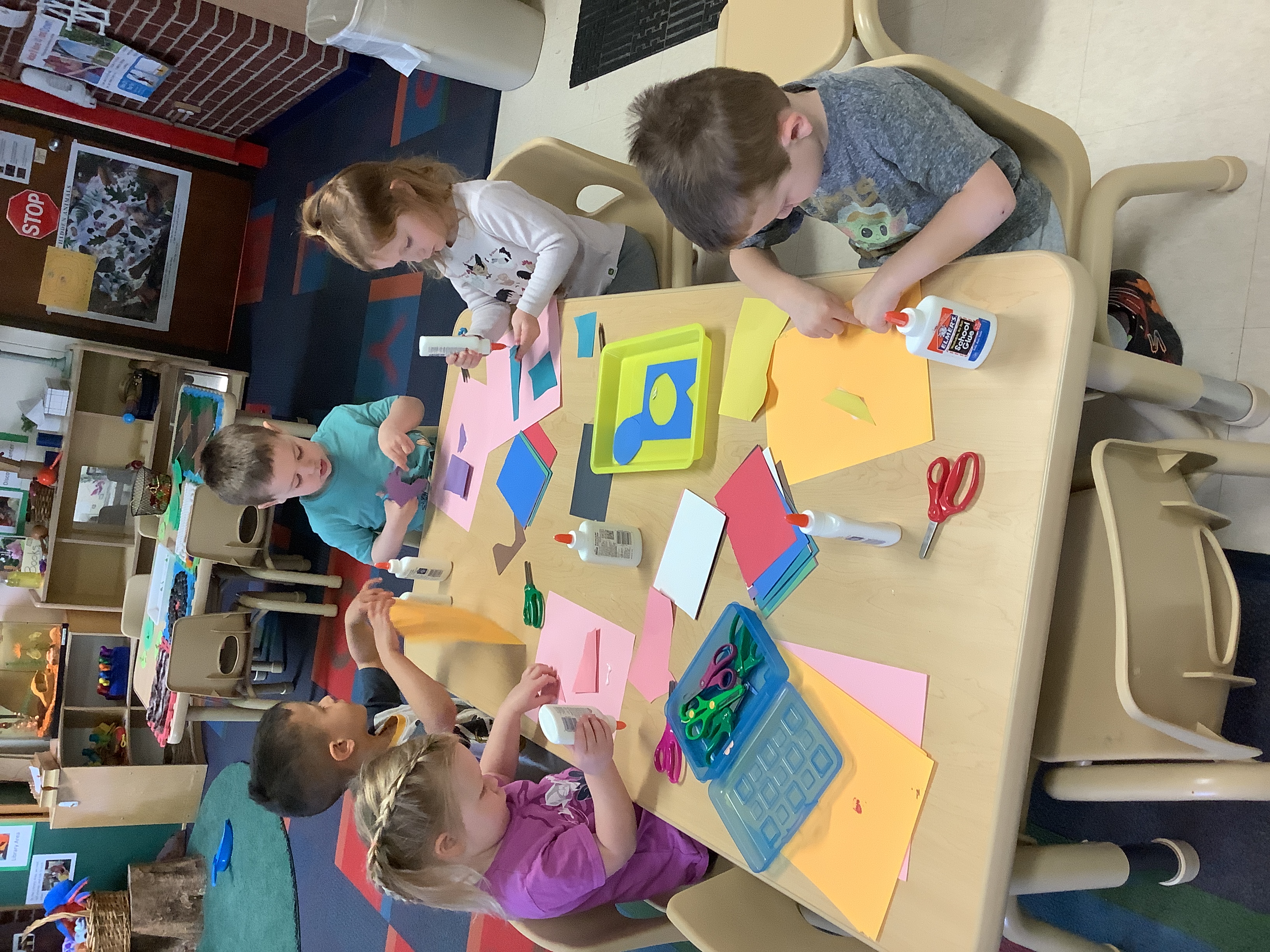 creating pictures by cutting and gluing paper like Henri Matisse