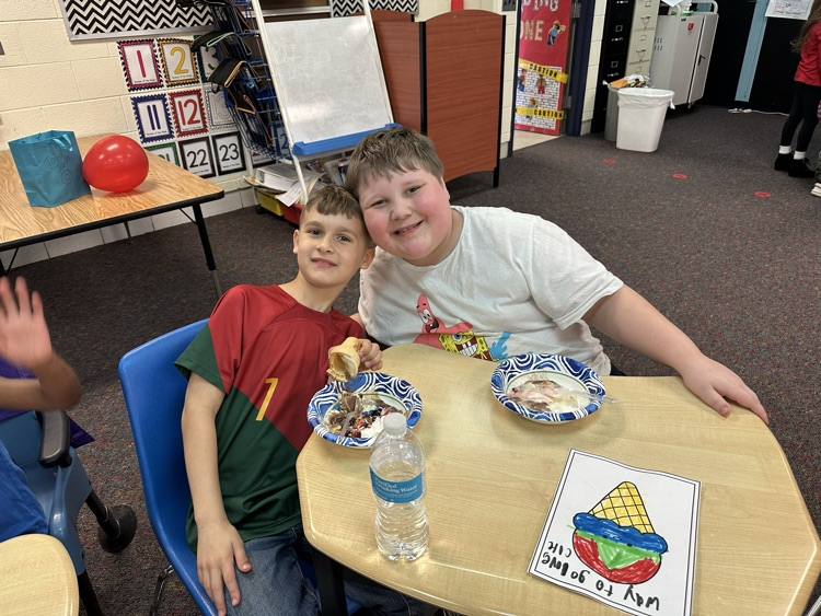 two friends sitting at a table