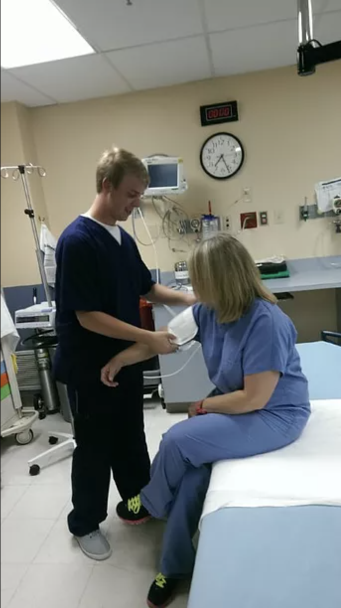 Nurse checking blood presure