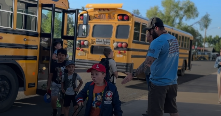 greeting students from the bus
