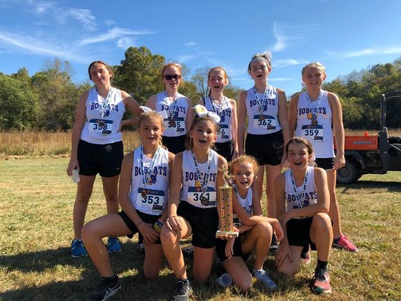 Nine Cross Country students with medals