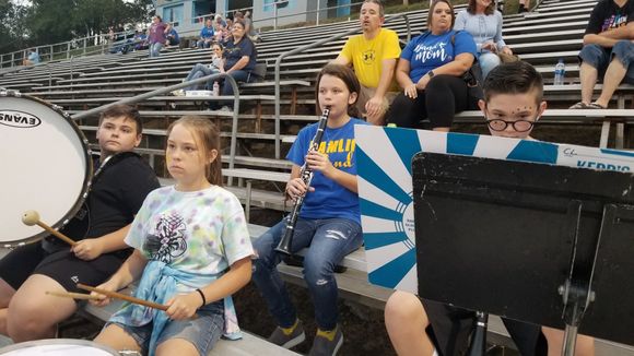 Music students playing in the bleachers