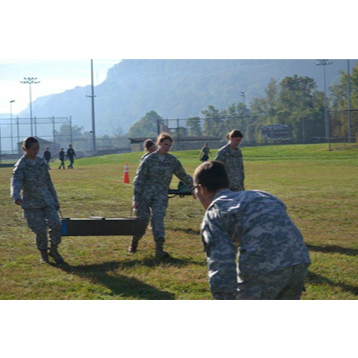 2 students carrying something heavy together