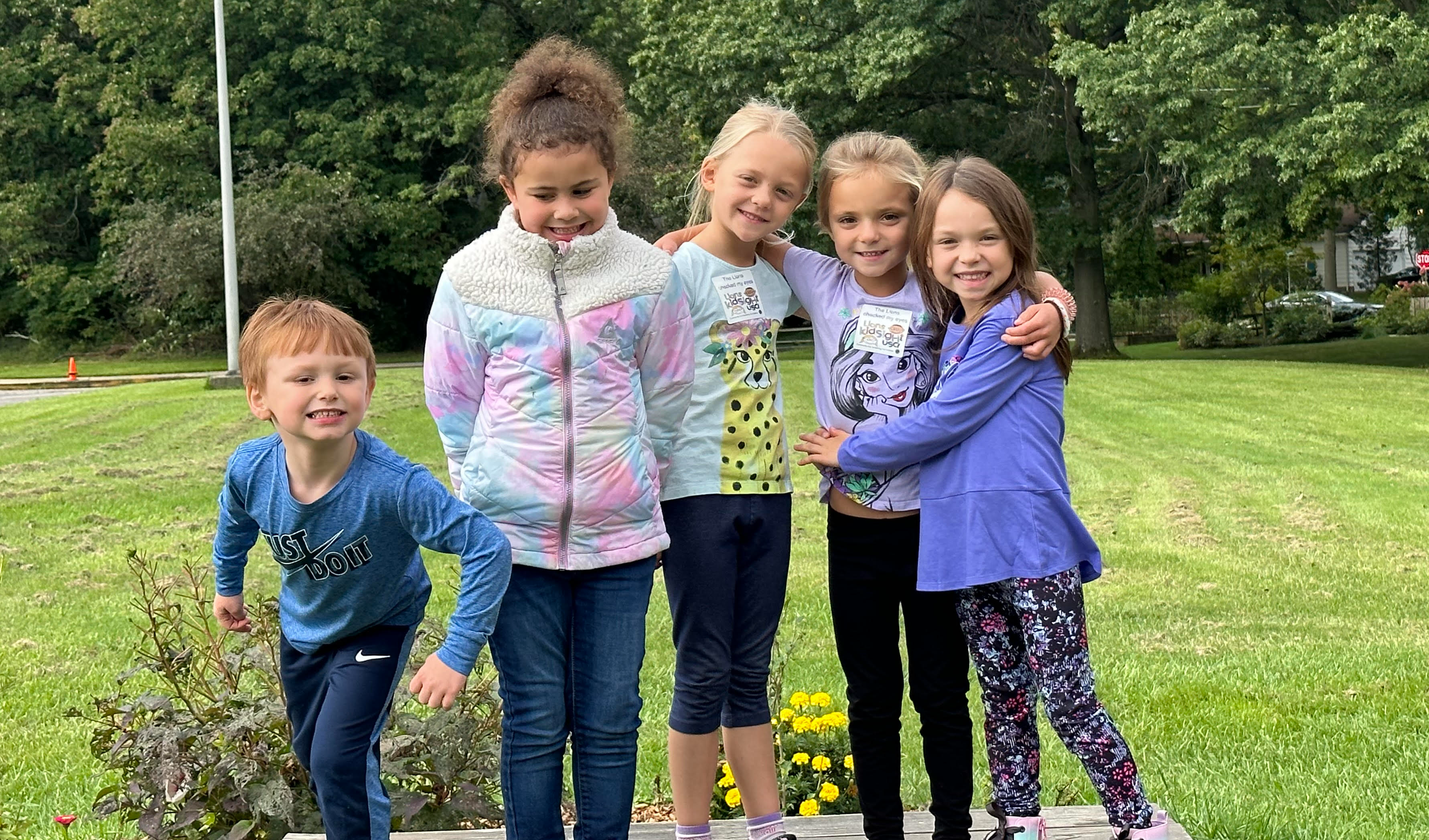 Five students posing outside