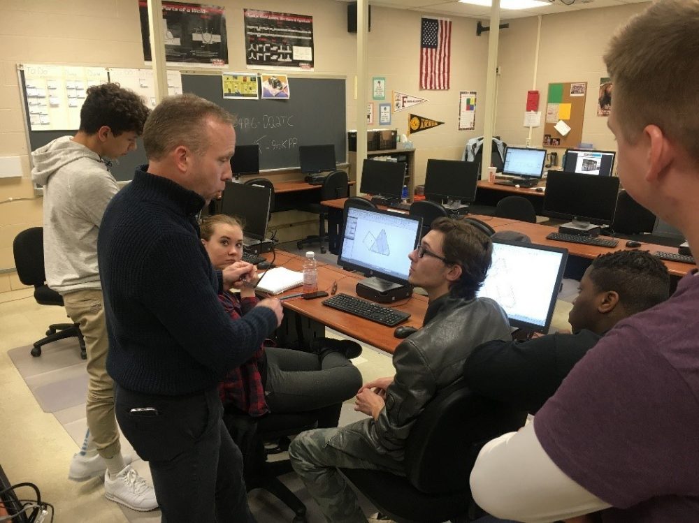 A student talking to another student