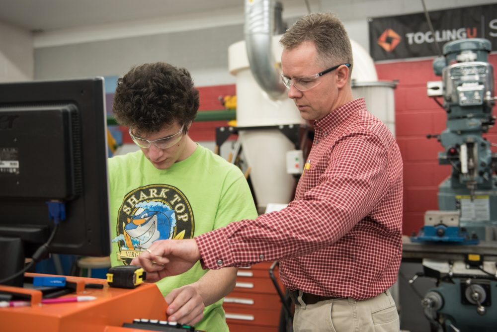 Engineering student working with the professor