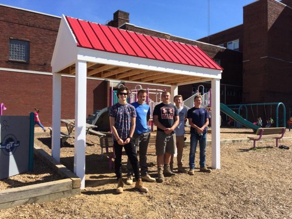 Construction students underneath the pavilion they built