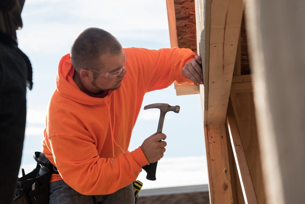 Construction student hammering