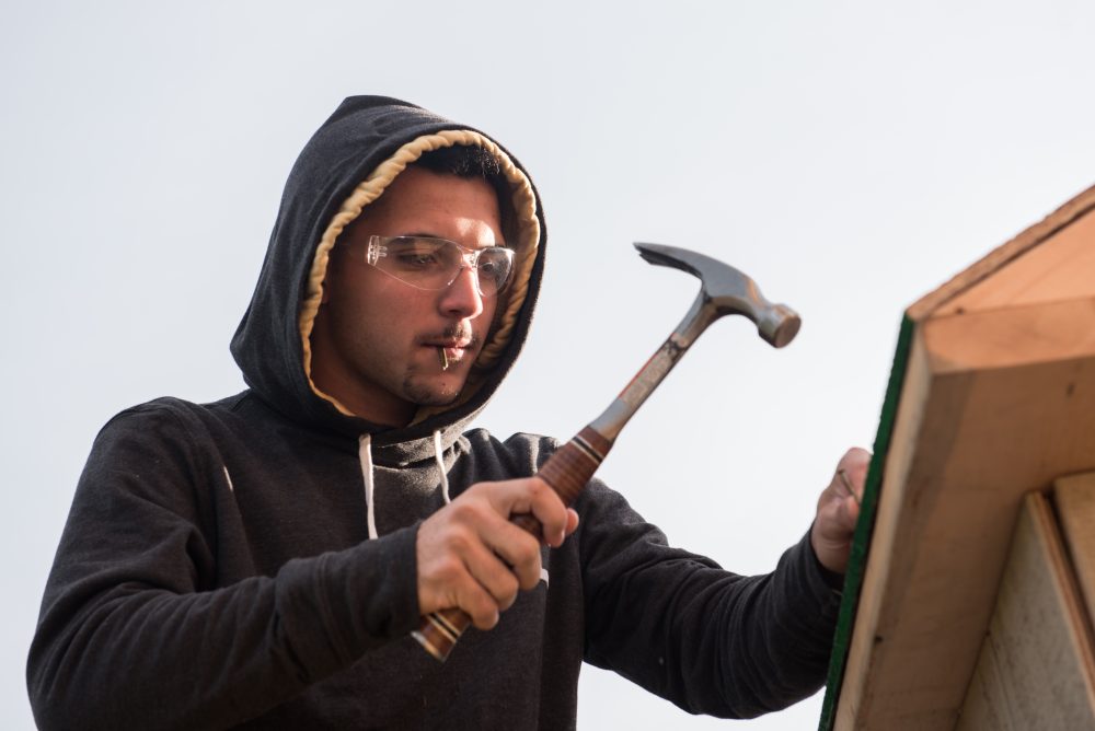 Construction student hammering