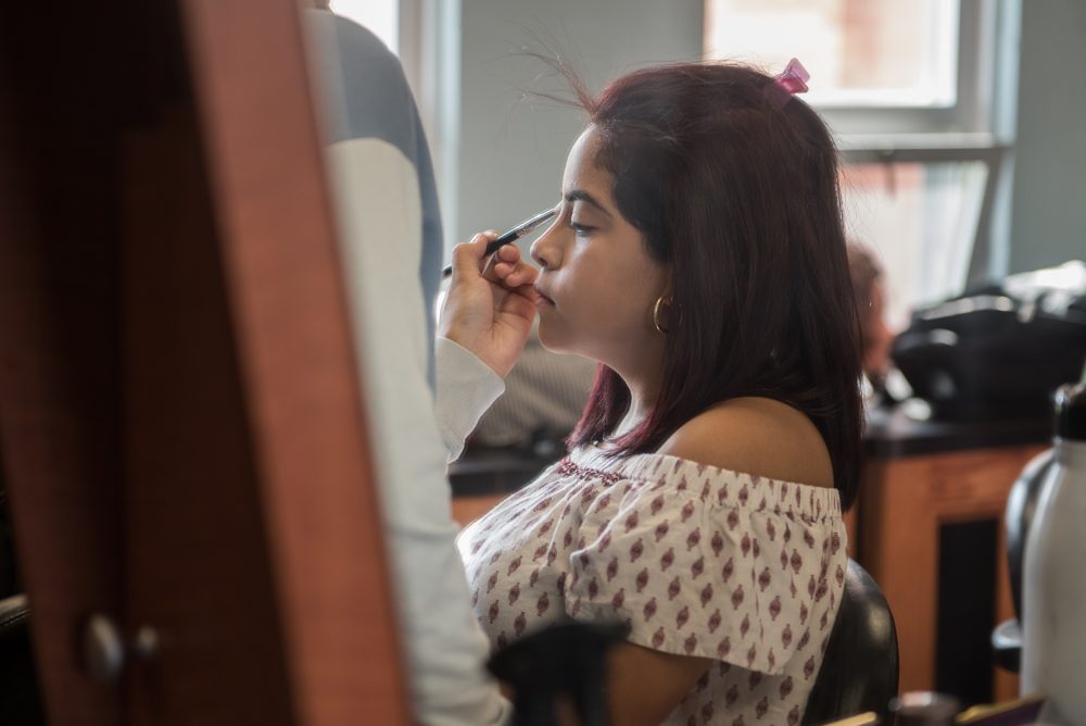 A student doing a student's makeup
