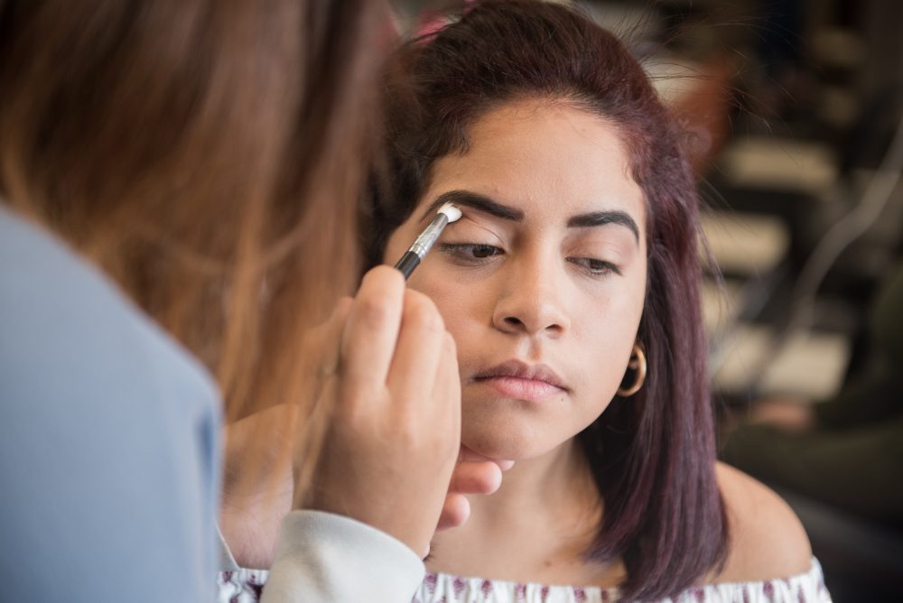 A student doing a student's makeup
