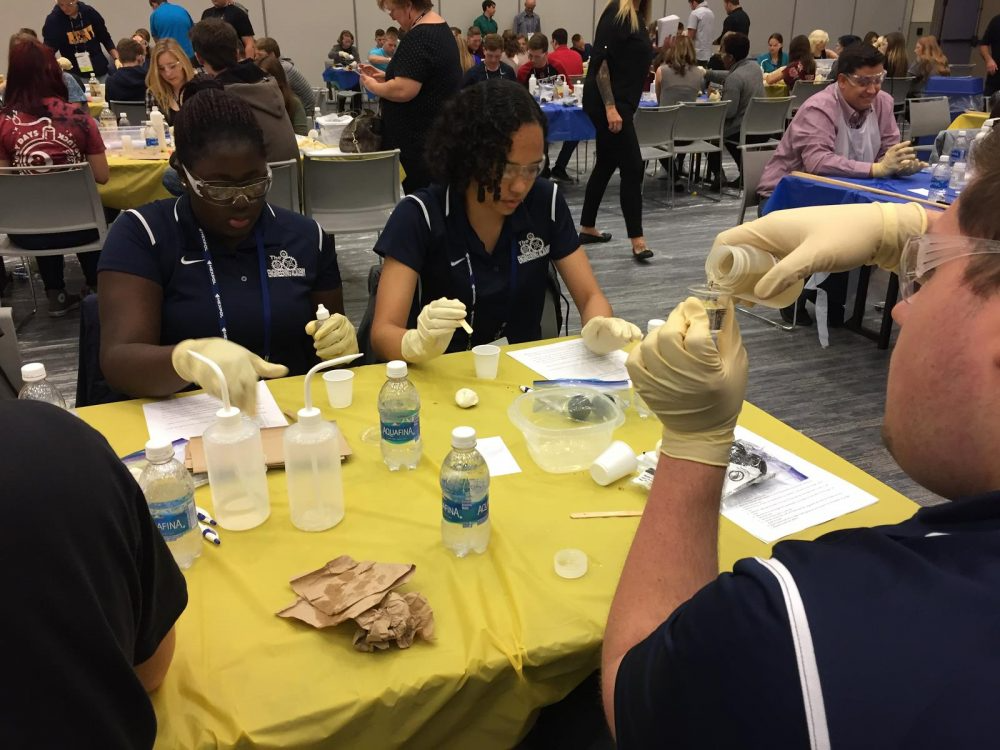 Students participating in hands-on polymer work