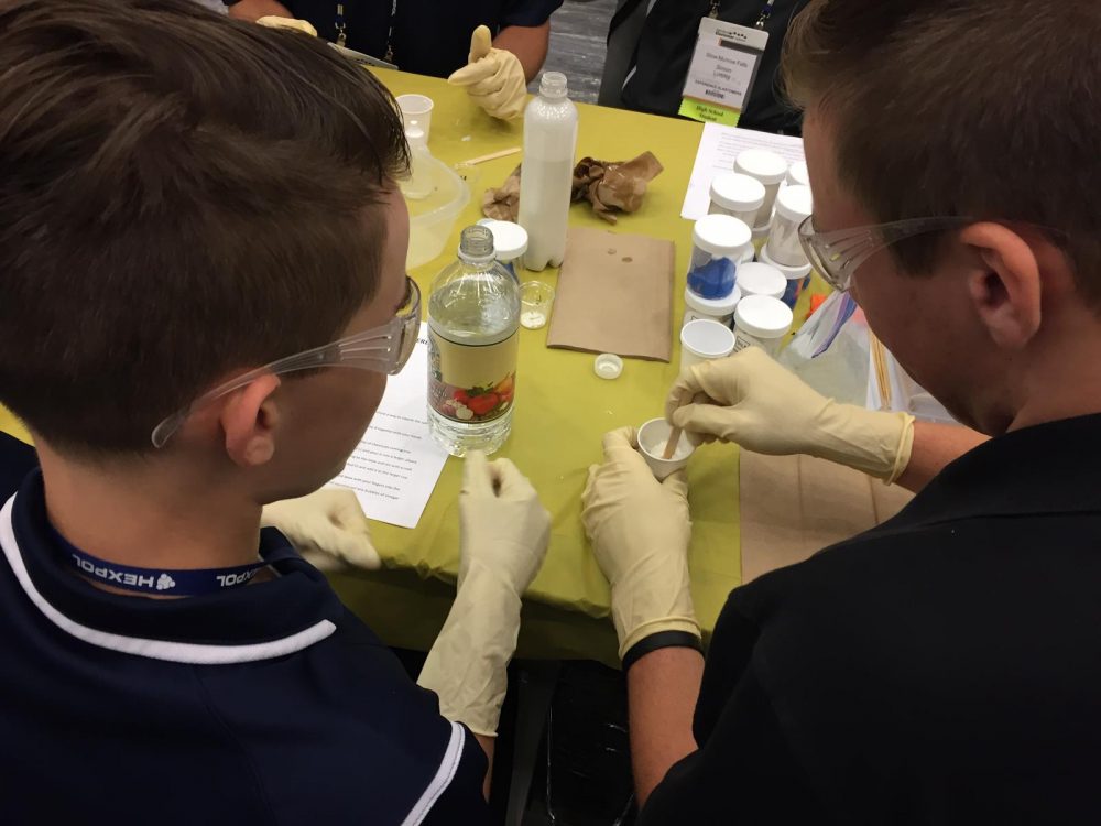 2 students working with polymer