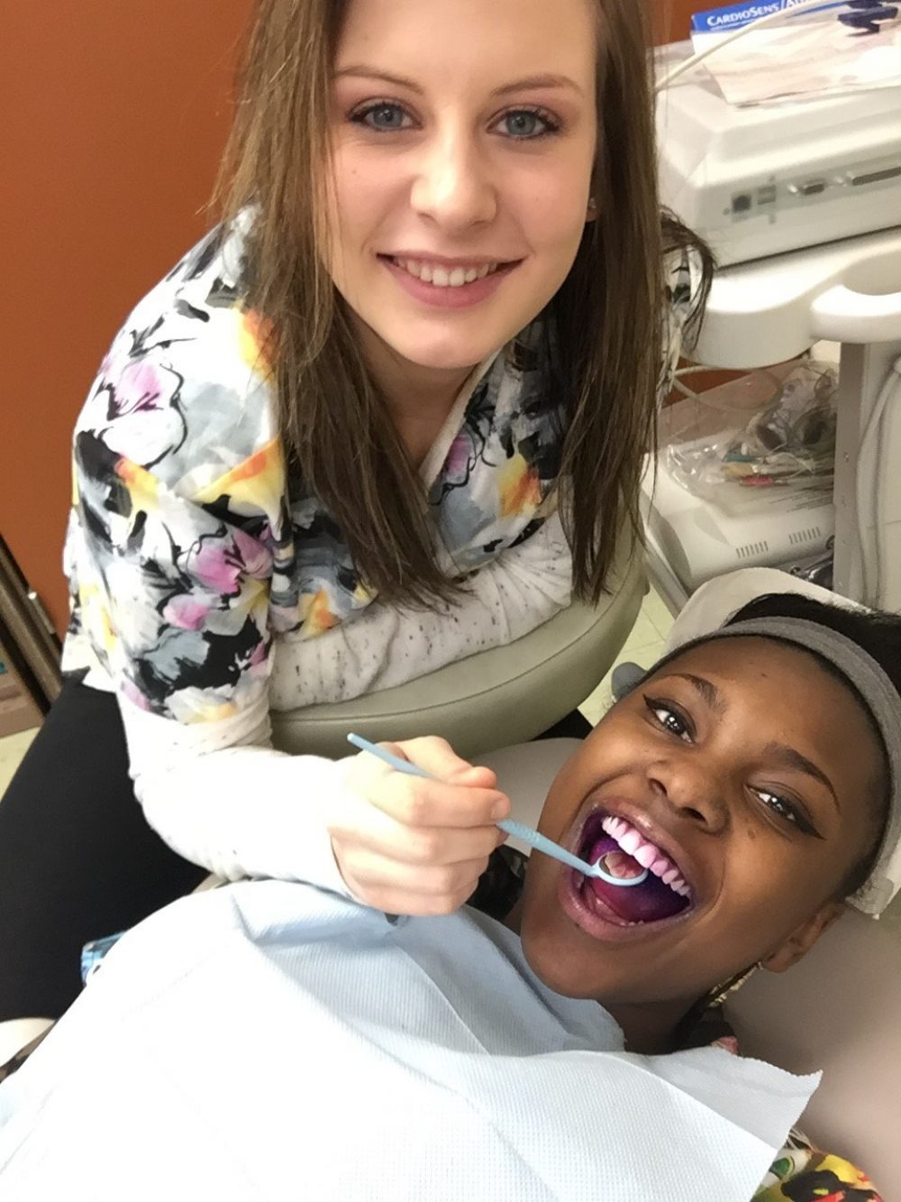 Student practicing dental techniques on another student