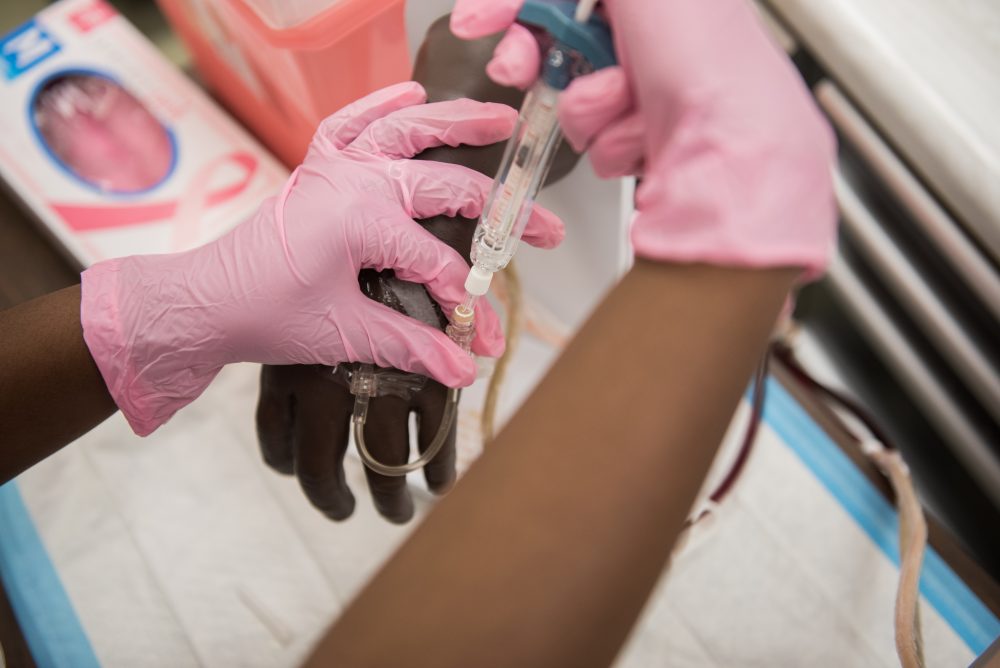 Student practicing giving medication through an IV
