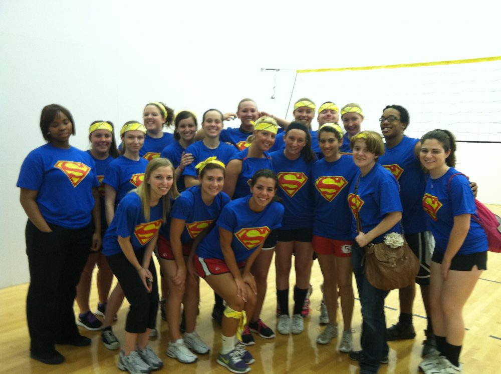 A group picture with all the students wearing Superman shirts