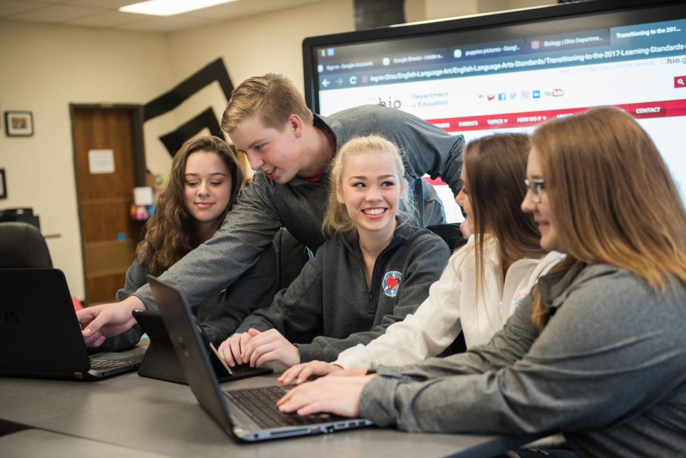 Several students working on a project together