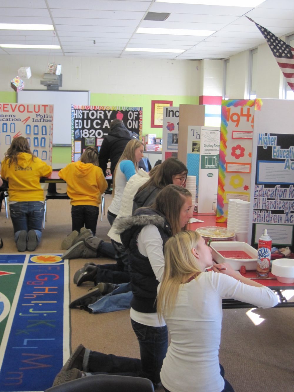 Students with their own trifold board projects