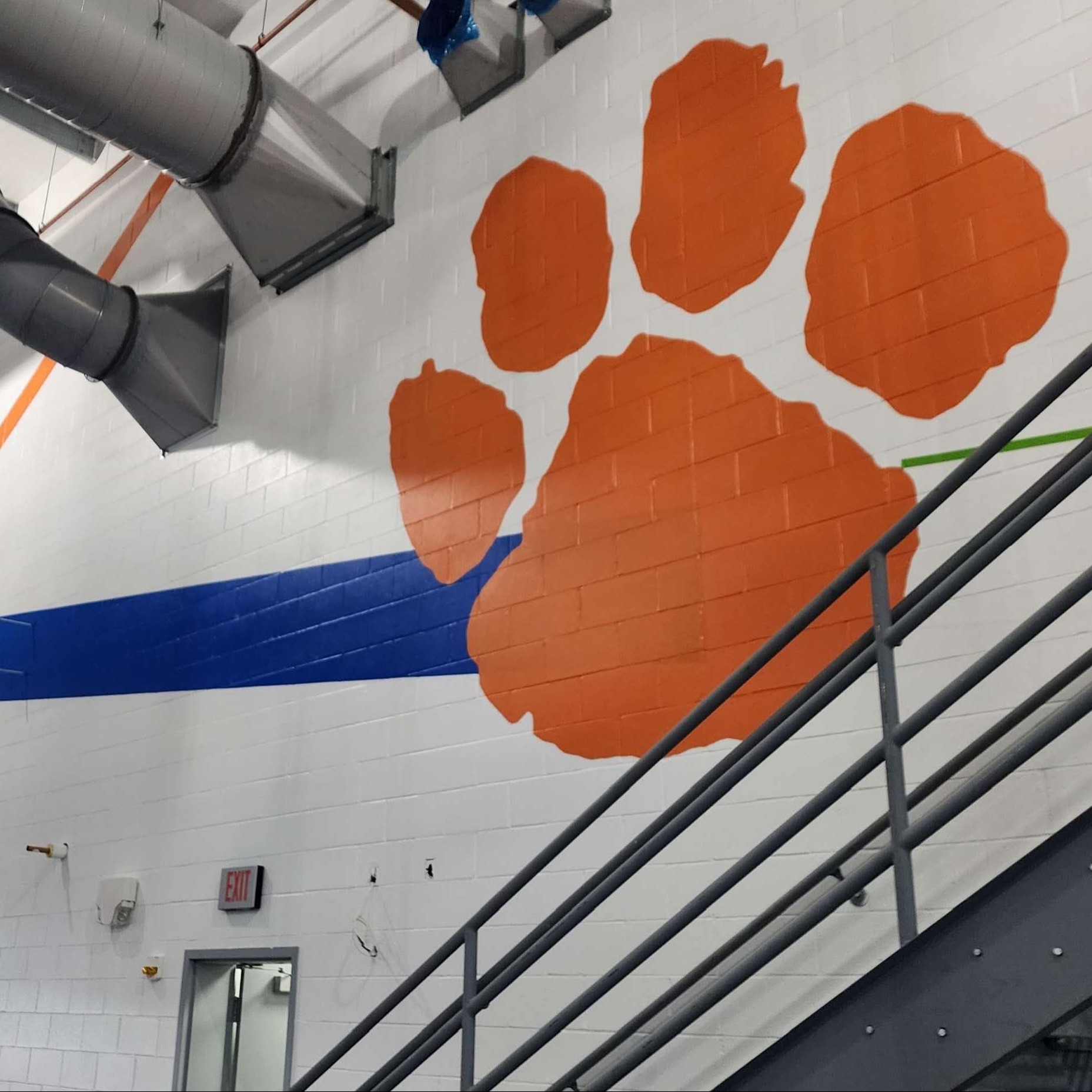 Paw Print on west masonry wall