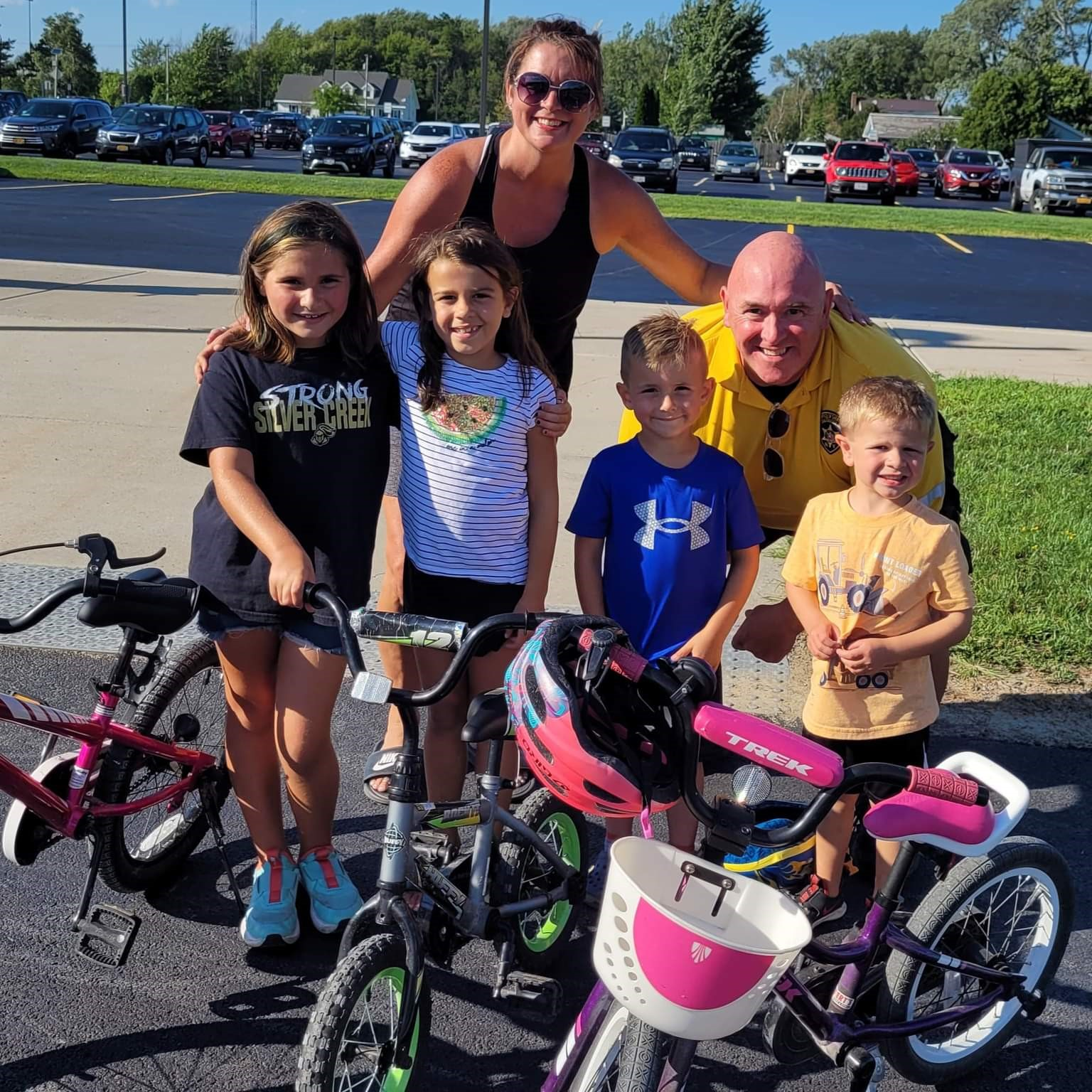School Nurse & SRO with students at a Bike Rodeo