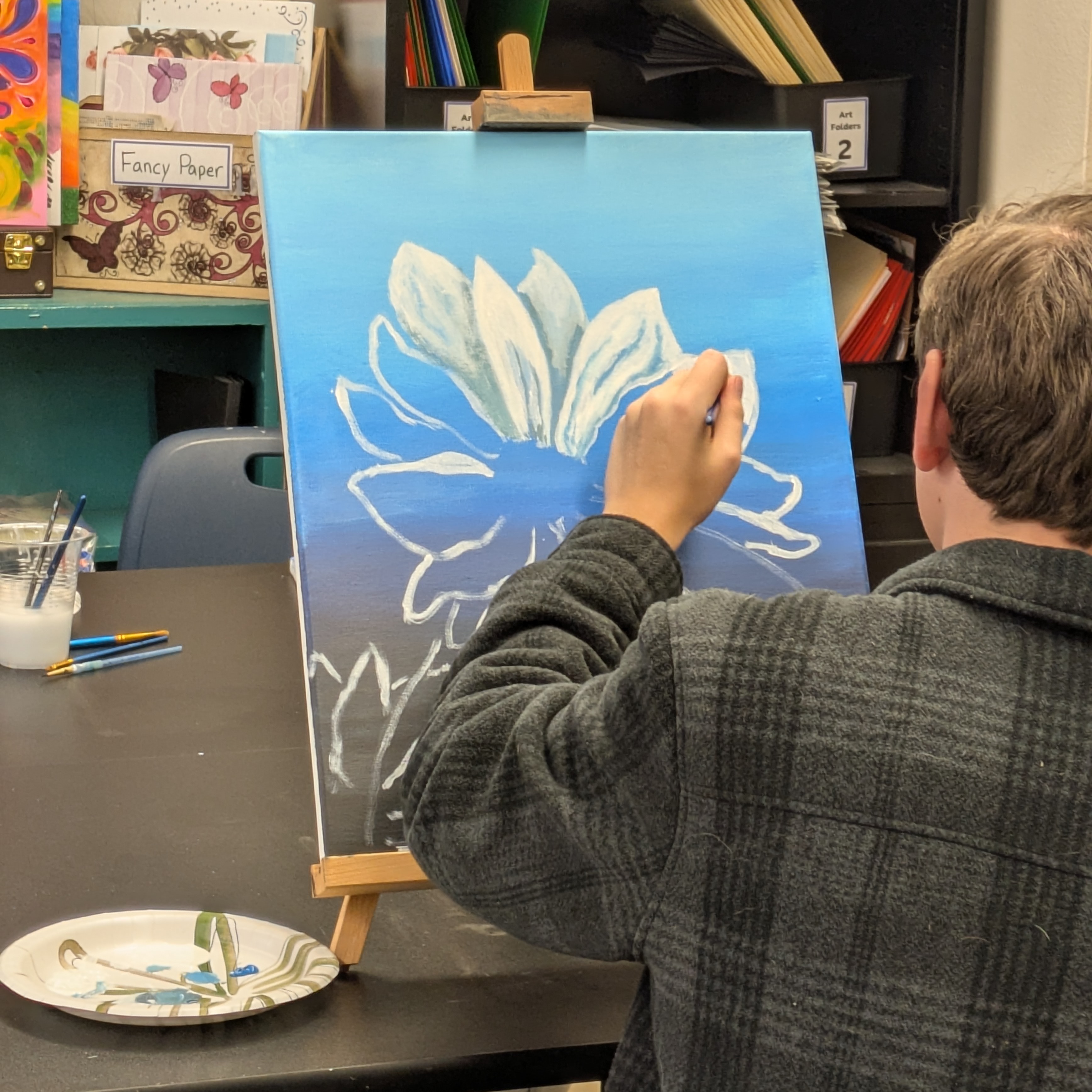 Student painting flower picture
