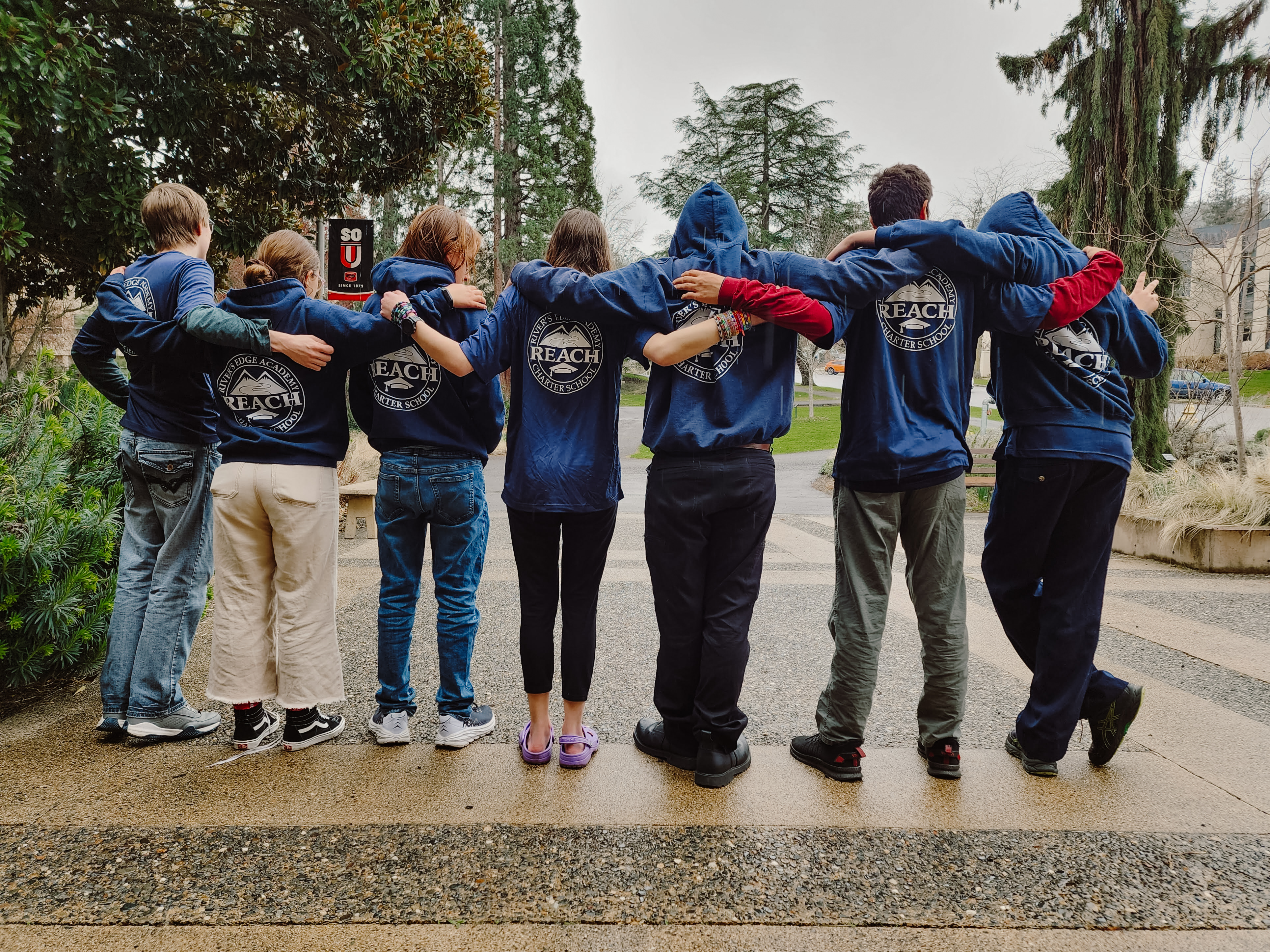 Brain Bowl Team standing together with Reach Sweatshirts