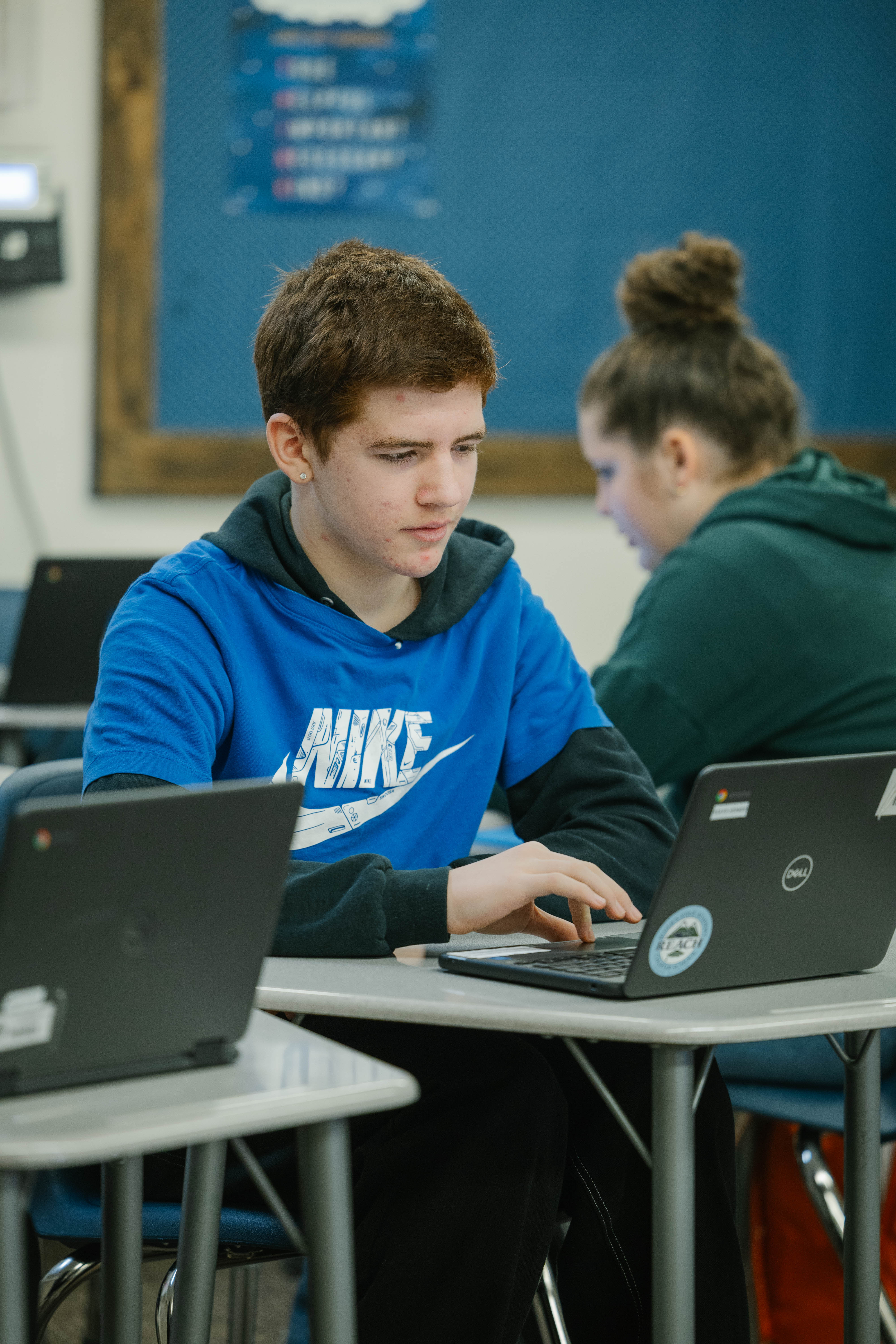 Student at desk working on computer