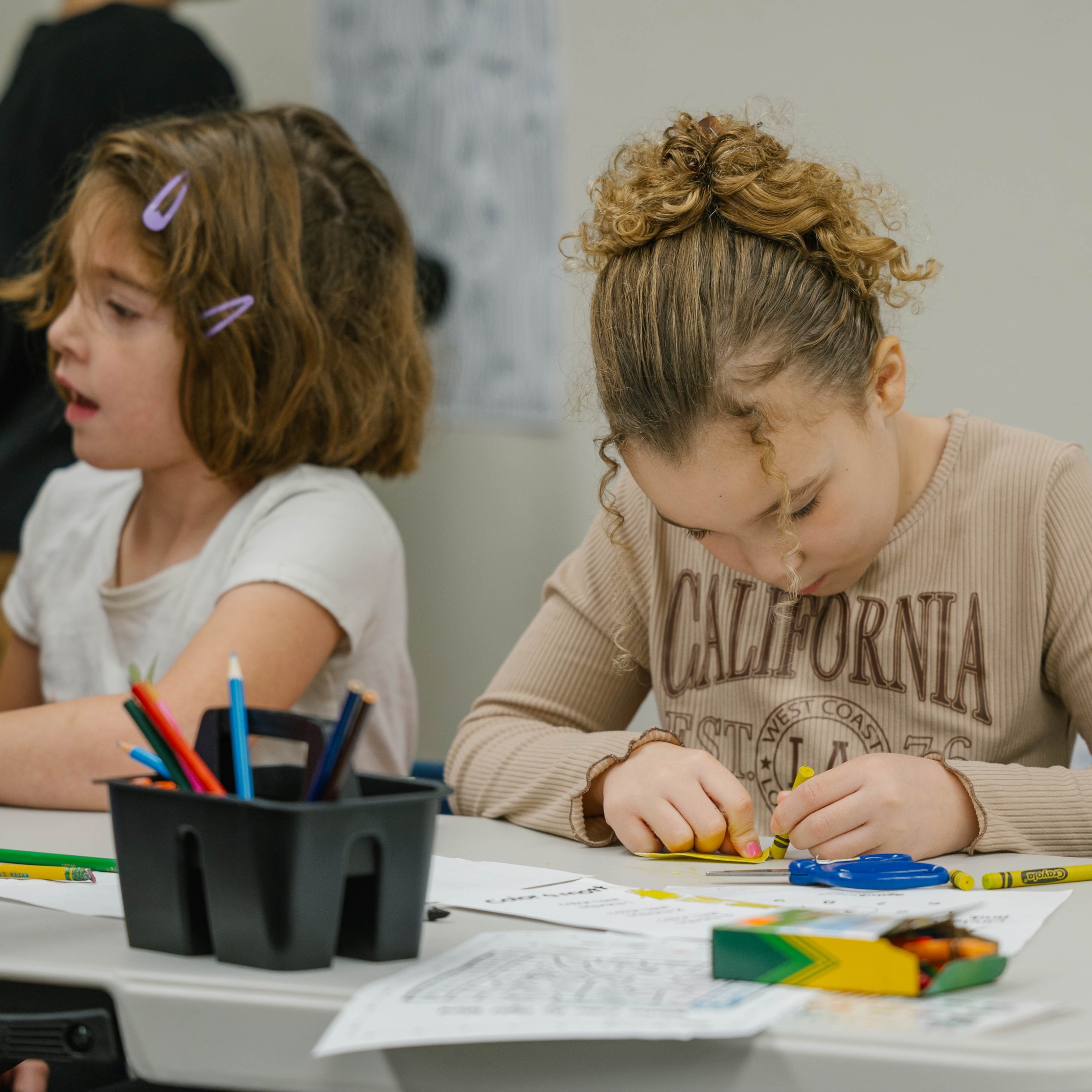 students coloring in classroom