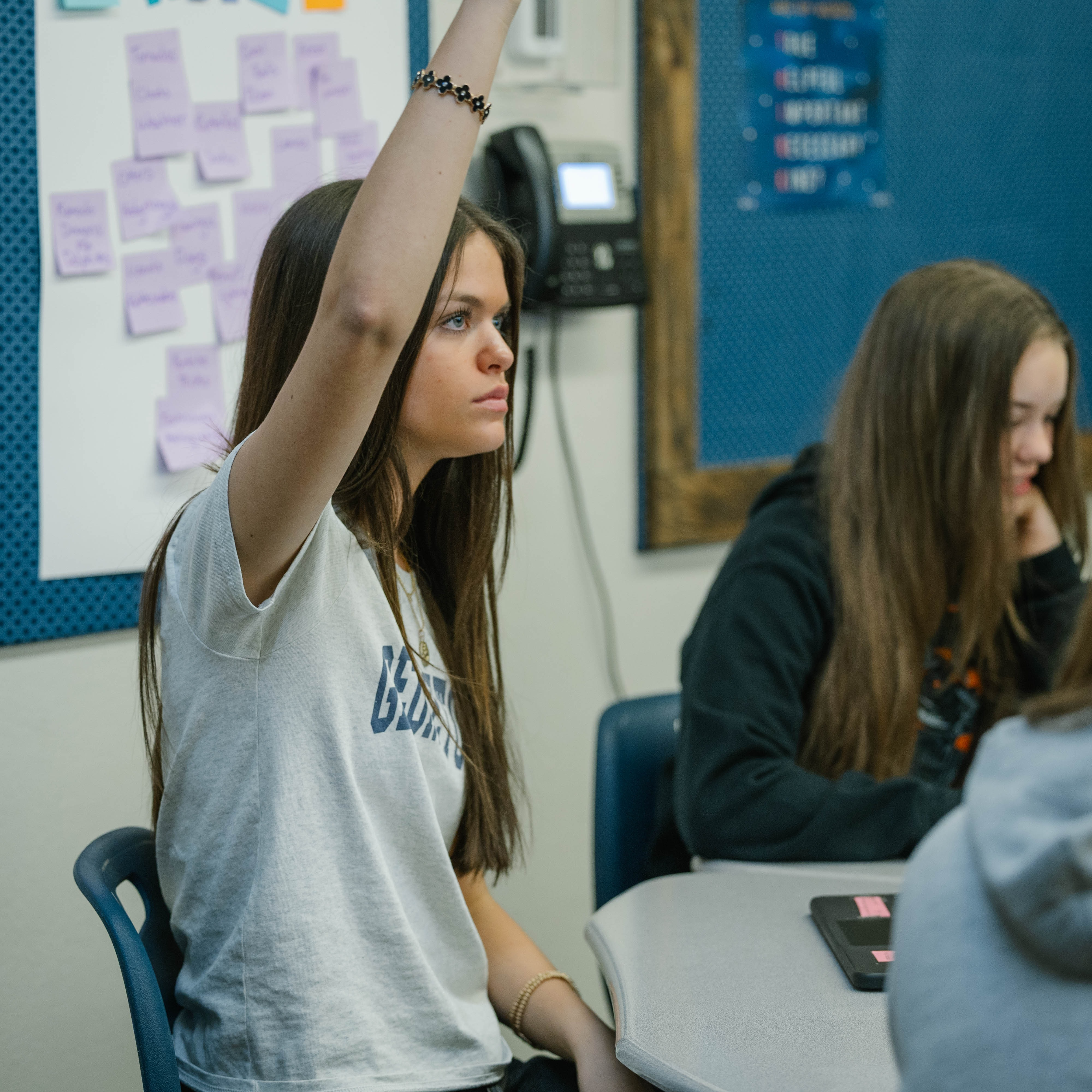 student raising hand