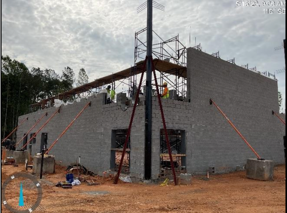 Gym walls with structural steel column rising to second story