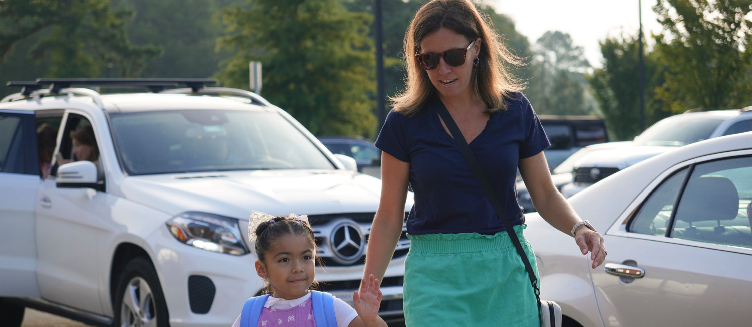 Principal walking with student 
