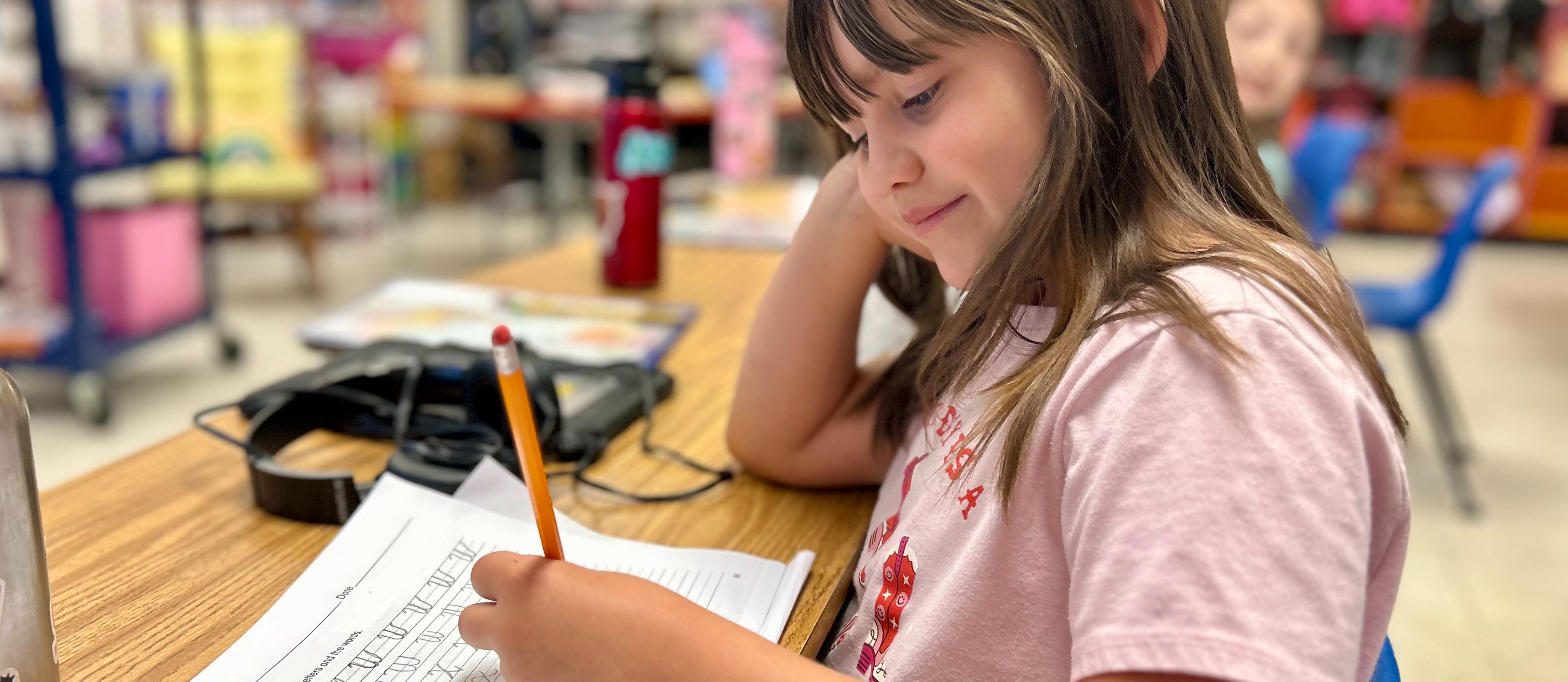 student writing cursive