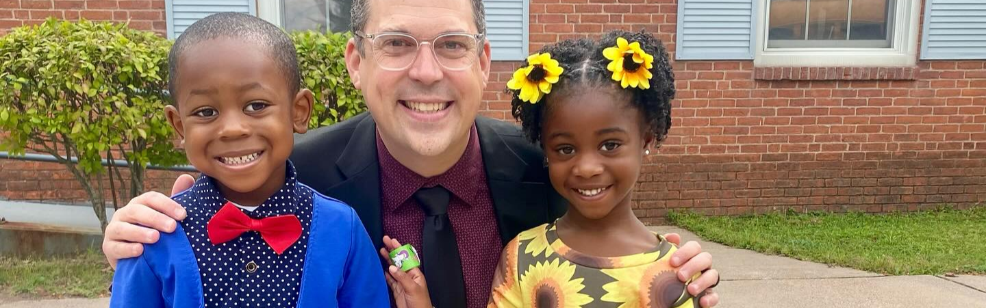 Principal Mihalko with two students