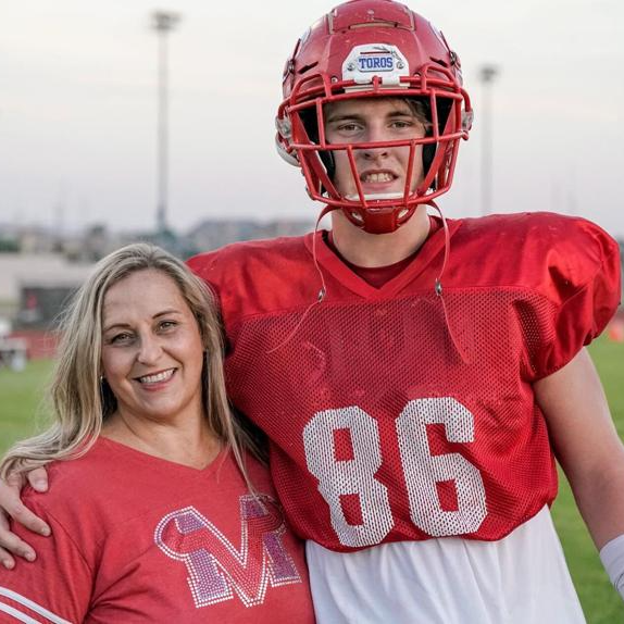 Mom with football player son
