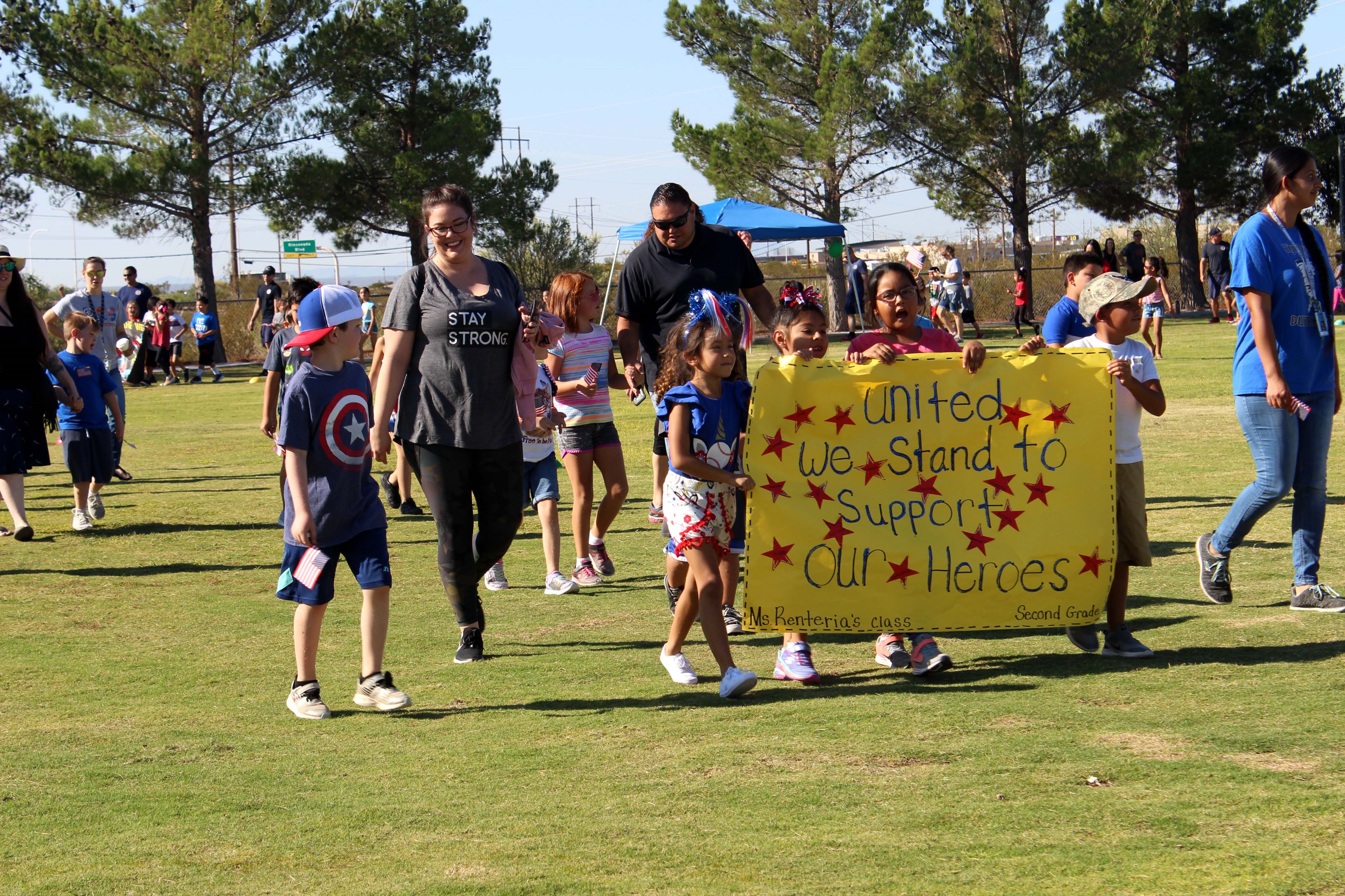 Students from Highland Elementary carry signs thanking local law enforcement agencies, paramedics, emergency medical technicians, firefighters and rescuers for their support in keeping the community safe during the annual Jog-a-Thon. #NM #LCPS #Education 