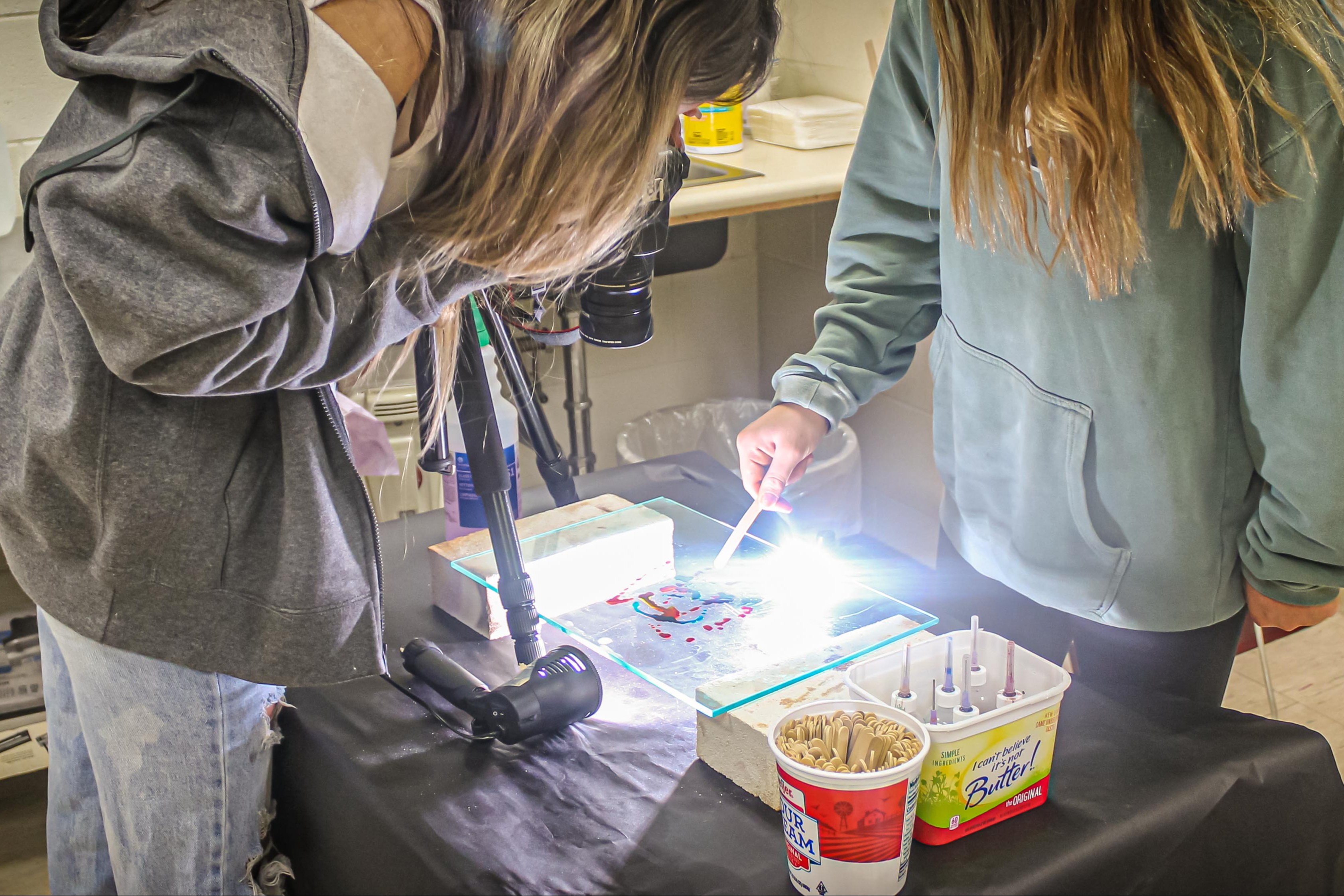 Students working on  melting colors for art project