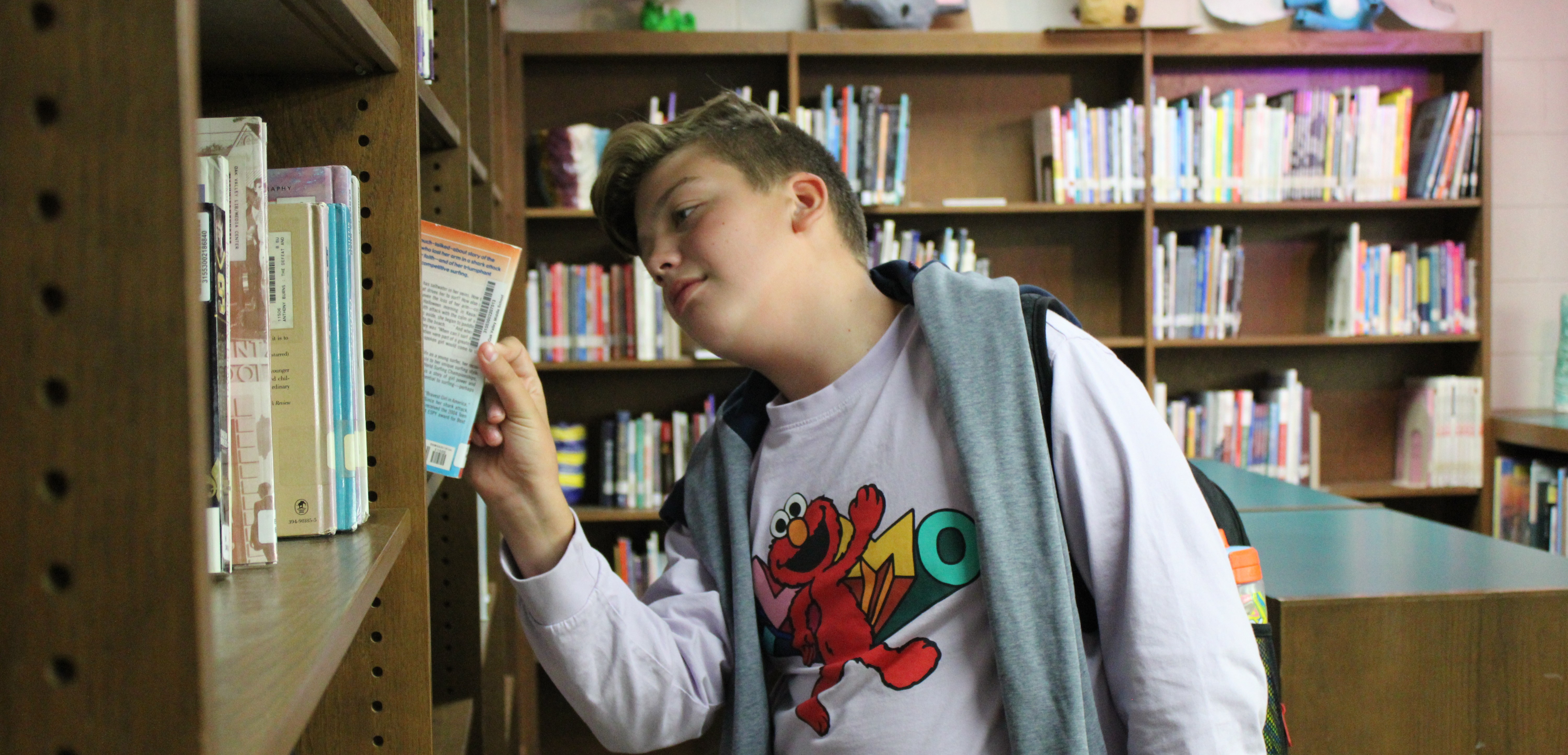 student looking through books