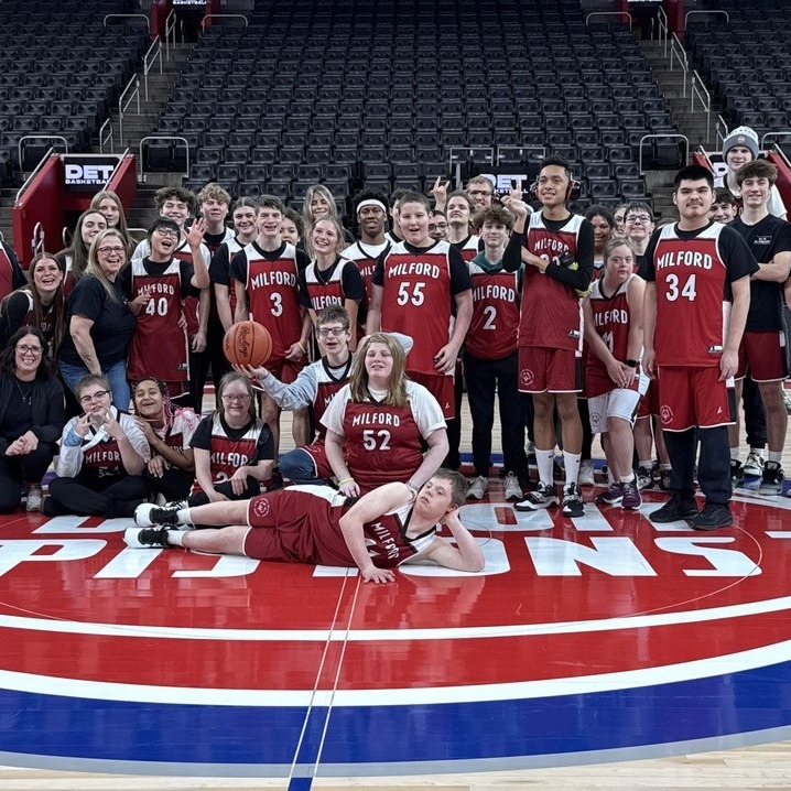 HVS Unified team on the court in downtown detroit before a pistons game