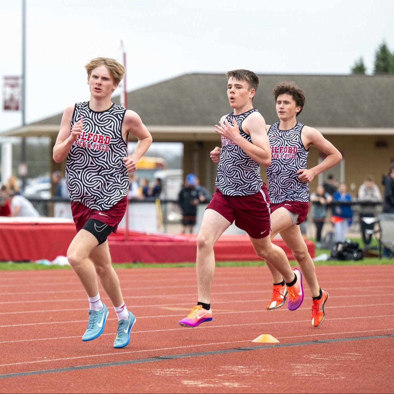 boys running on track during meet
