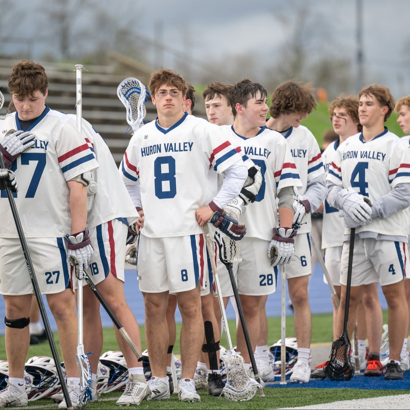boys lacrosse team standing in line for anthem