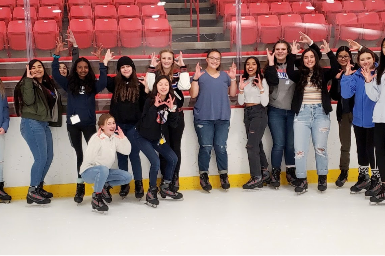 Students posing at ice rink