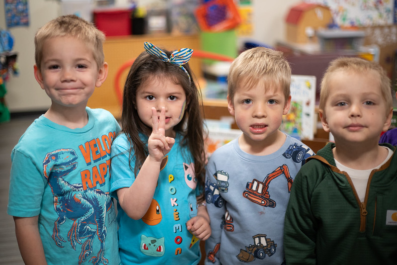 students standing together in classroom